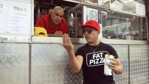 Sleek The Elite and Paul Fenech in 'Pat Pizza: Back In Business'. Image: Twitter